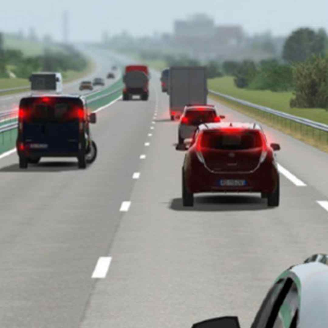 Highway scene with multiple vehicles on a clear day