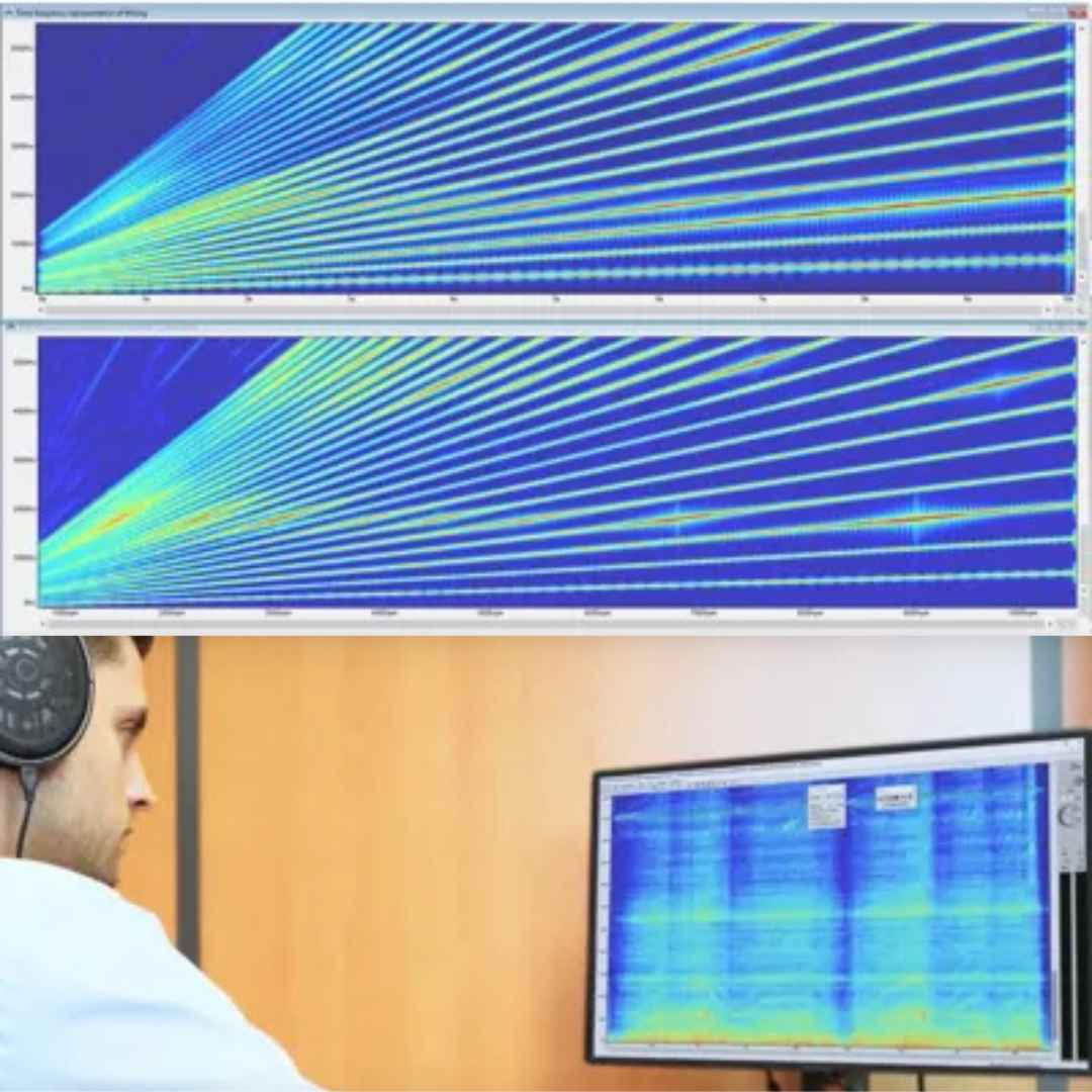 Person wearing headphones looking at a large screen displaying complex wave patterns.