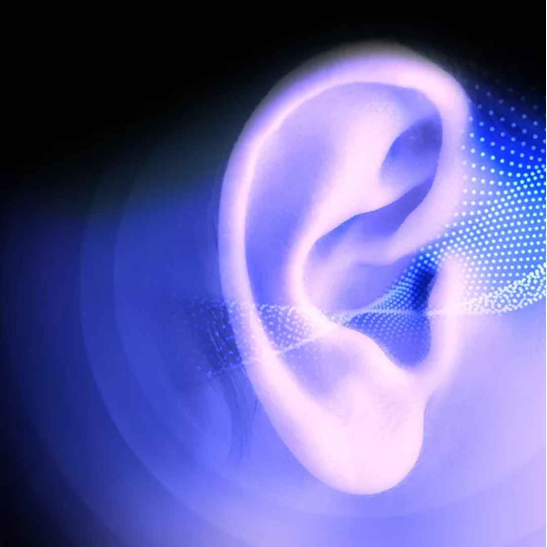 Illustration of a glowing ear with sound waves on a dark background